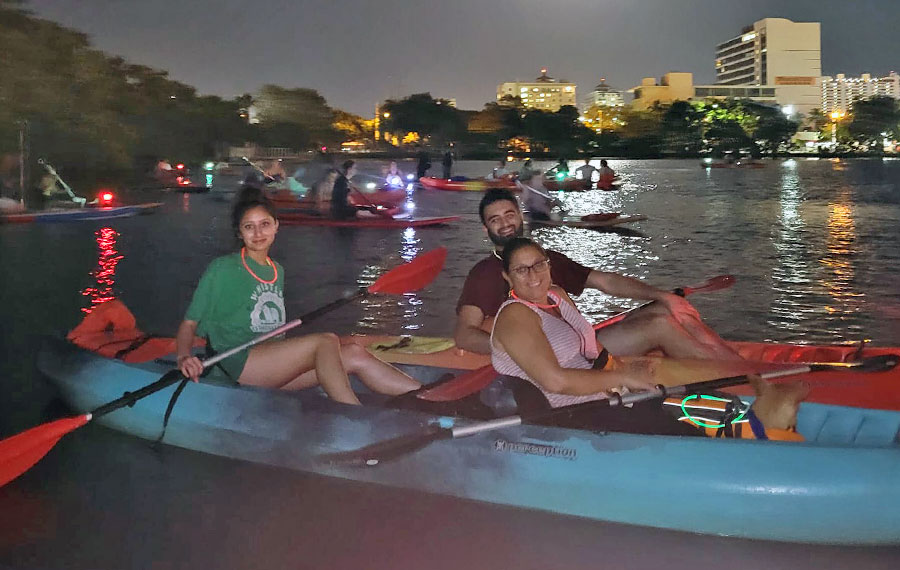 family of three on two kayaks at night on inlet sunrise paddleboards fort lauderdale