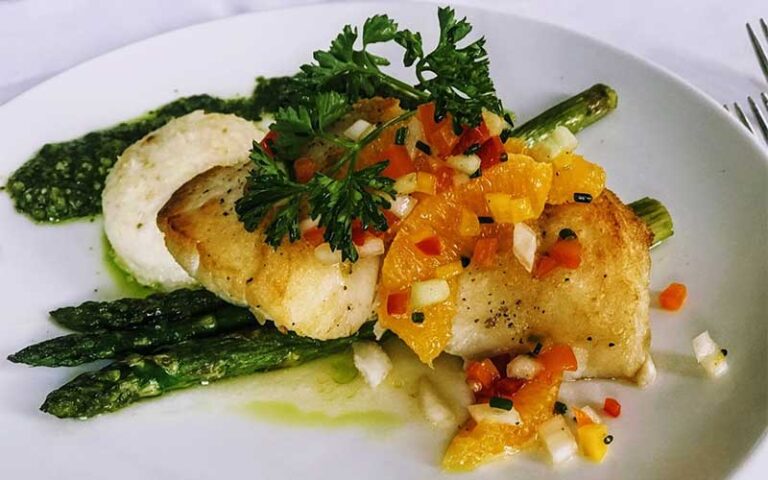 fish with asparagus and colorful garnish at bijou garden cafe sarasota