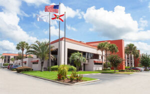 front exterior of hotel with flags at grand hotel orlando