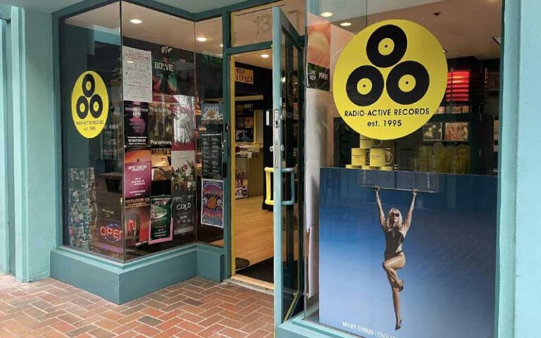 front exterior of store with album artwork in windows at radio active records fort lauderdale