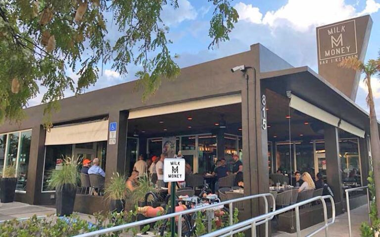 front exterior with patio seating at milk money bar kitchen ft lauderdale