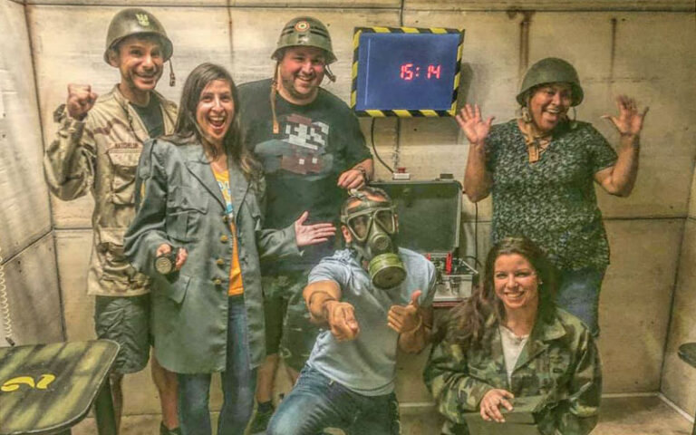 group of escape game players in nuclear fallout themed room at fox in a box miami