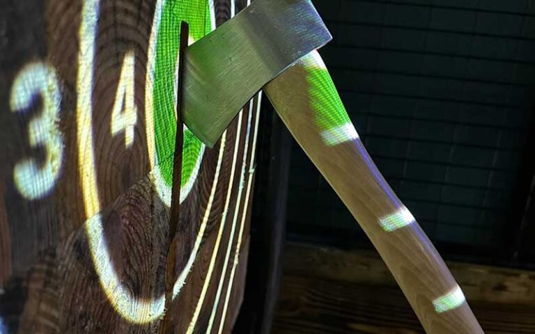 hatchet embedded in wooden target at pinfish entertainment tavernier fl keys
