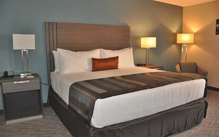 king size bed with night stands at grand hotel kissimmee