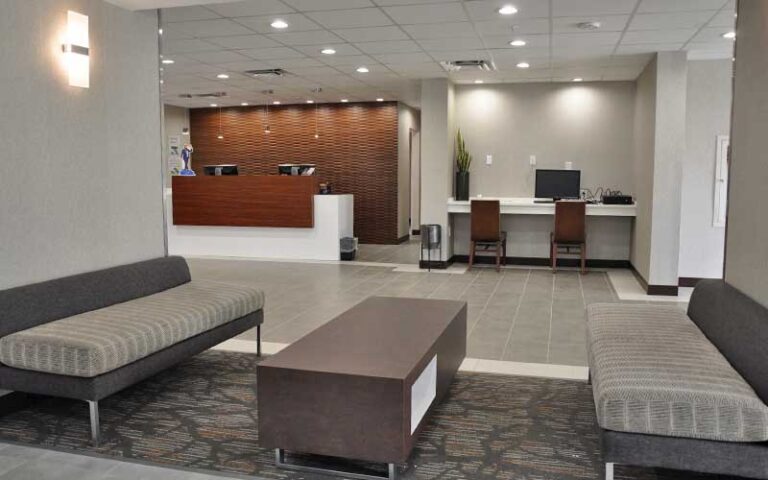 lobby with front desk business center and seating at grand hotel kissimmee