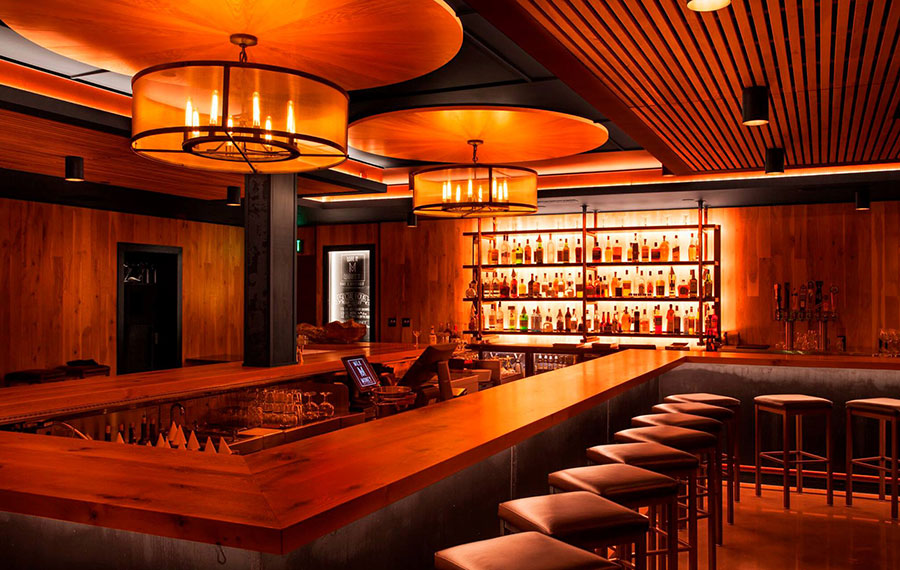 modern style bar area with orange lighting at milk money bar kitchen
