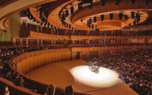 musician performing on grand piano onstage at adrienne arsht center for the performing arts miami