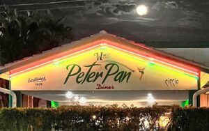 night exterior of restaurant with moon and clouds at peter pan diner fort lauderdale