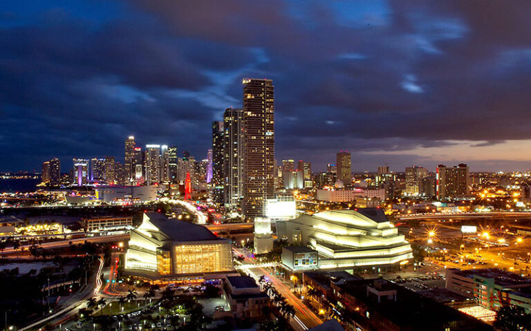 night skyline with bay and high rise buildings at adrienne arsht center for the performing arts miami