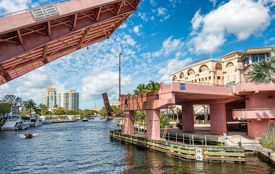 pink drawbridge raising with boat on new river fort lauderdale