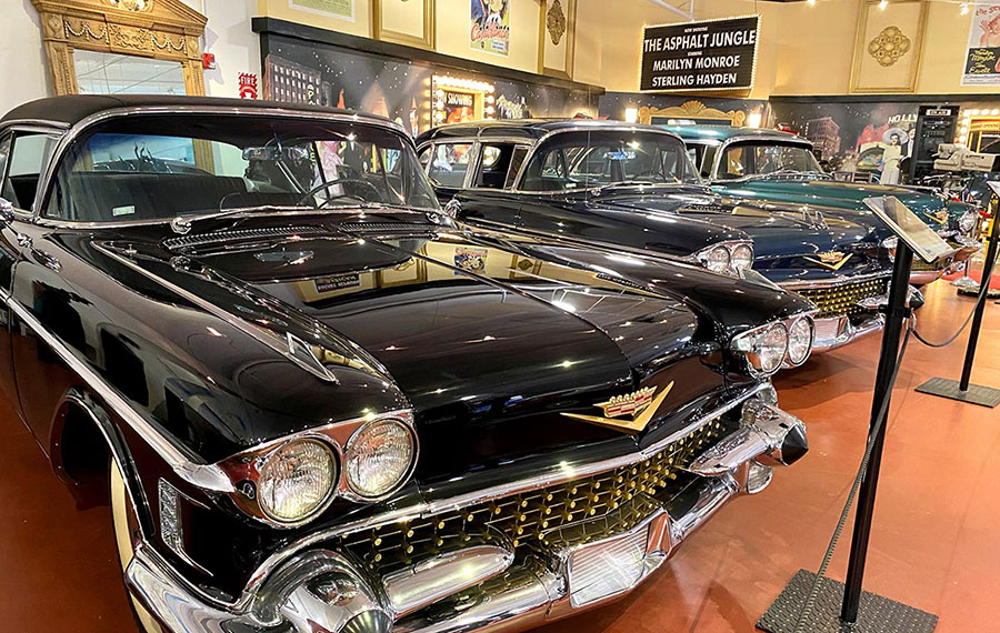 row of cadillacs in auto exhibit room at dauer museum of classic cars