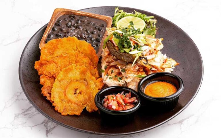 seafood entree with beans and tostones at milk money bar kitchen ft lauderdale