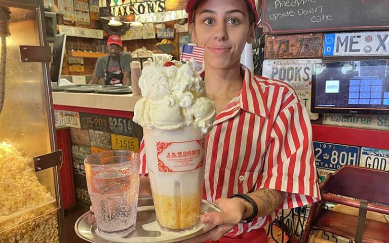 server holding tray with huge sundae at jaxsons ice cream parlor fort lauderdale