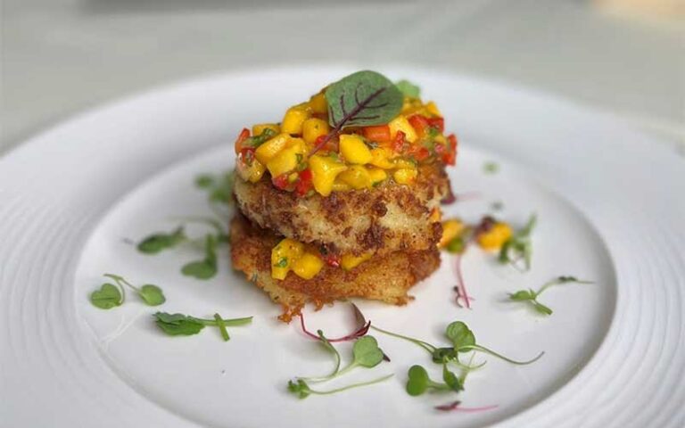 small crab cake with corn compote and garnish at bijou garden cafe sarasota