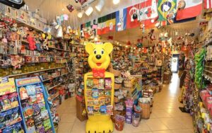 store with aisles and gummy bear display at to the moon marketplace ft lauderdale