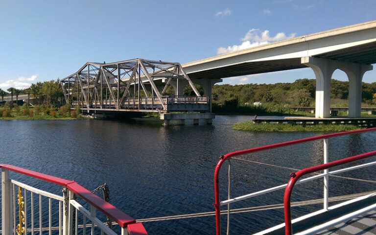 view from boat deck of rail bridge at st johns rivership co sanford