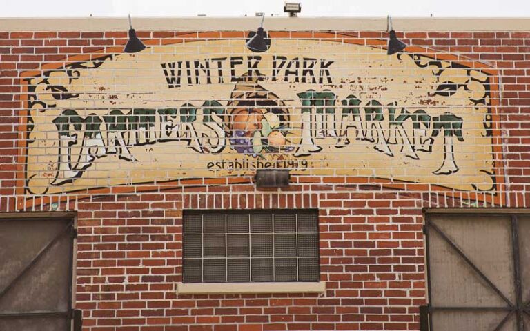 winter park farmers market sign on train depot at park avenue district winter park