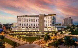 aerial view of high rise hotel at night at luminary hotel and co fort myers