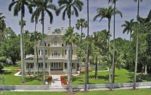aerial view of property with house and tall palms at burroughs home and gardens fort myers