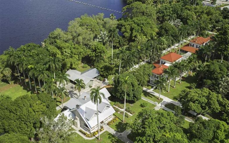 aerial view of waterfront property with trees and preserved homes at edison and ford winter estates fort myers