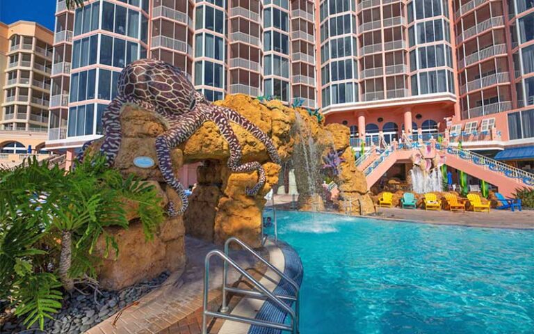 animal statues at pool area with hotel behind at pink shell beach resort marina fort myers