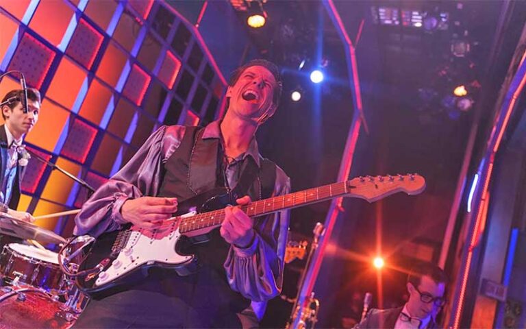 band performing on stage with colorful lighting effects at florida repertory theatre fort myers