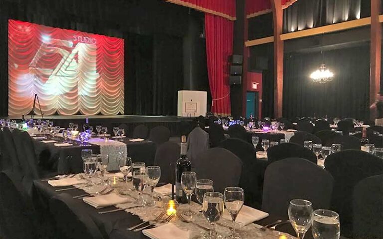 banquet event in theater space with studio 54 on screen at key west theater