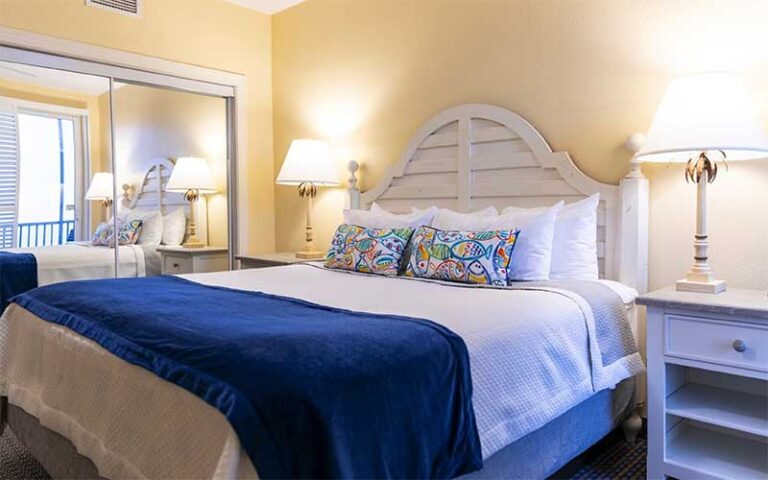 blue and yellow room with king bed at pink shell beach resort marina fort myers