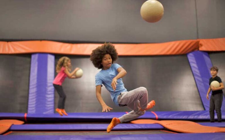 boy flipping in dodgeball match at sky zone trampoline park fort myers