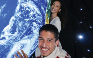 couple hugging earth globe at earth illuminated orlando