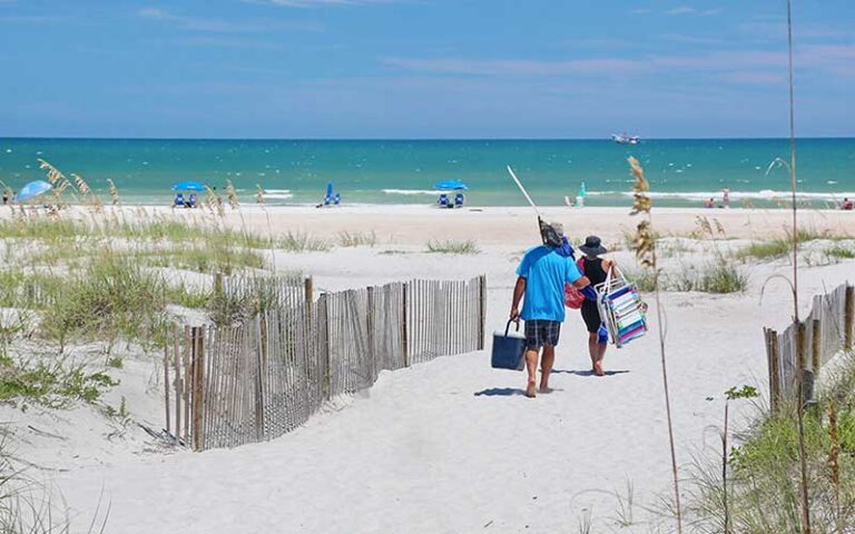 couple walking to beach along private access at la fiesta ocean inn suites st augustine beach