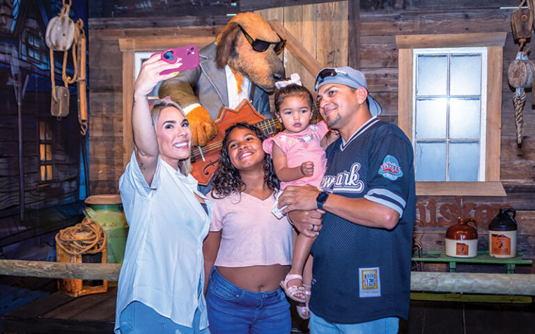 family taking selfie at lonely dog immersive orlando