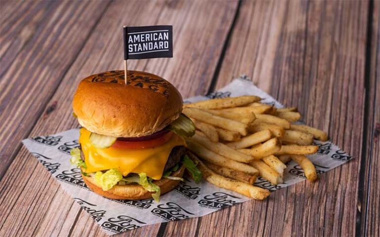 deluxe cheeseburger with fries and american standard flag at fords garage fort myers