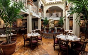 dining room with old spanish decor statue and atrium at columbia restaurant st augustine