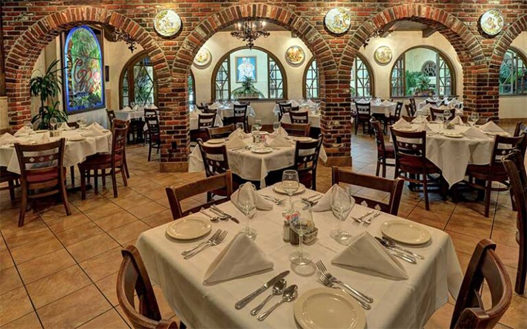 dining tables with arched brick walls at columbia restaurant st augustine