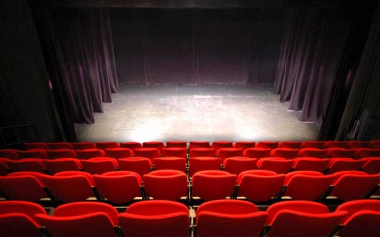 empty stage theater with red seats at marathon community theatre fl keys