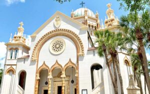 entrance of white church with gold embellishments at memorial presbyterian church st augustine