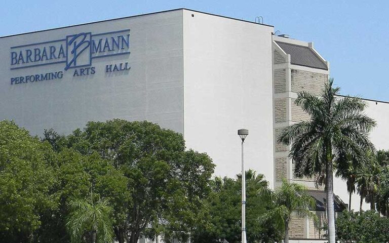 exterior of building front and side with sign and trees at barbara b mann performing arts hall fort myers