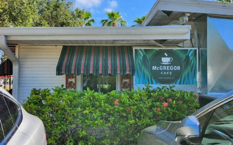 exterior of cafe with sign and shrubs below windows at mcgregor cafe fort myers
