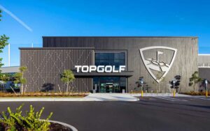 front exterior of building with blue sky at topgolf fort myers