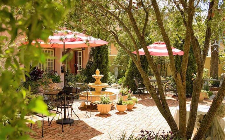 garden courtyard area with shady seating and fountain at casa de solana st augustine