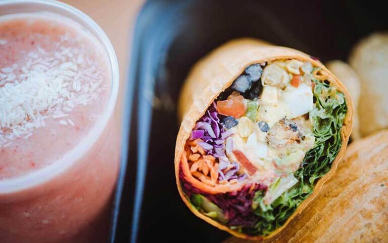 gourmet wrap with black bean and guac and pink smoothie at crave st augustine