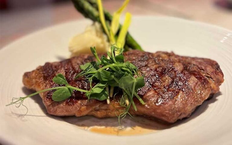 grilled steak with asparagus and garnish at the firestone fort myers