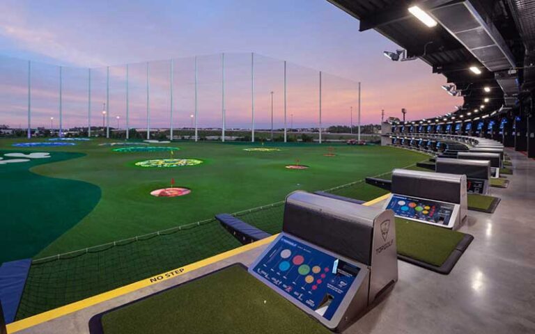 ground floor bays with lit up range at topgolf fort myers