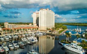 high rise hotel building with marina and open water at the westin cape coral resort at marina village fort myers