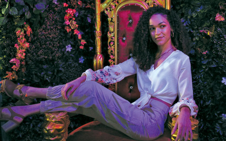 lady posing on throne at earth illuminated orlando