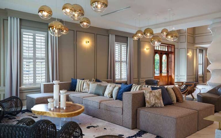 lobby with chic sofas and modern lighting globes at renaissance st augustine historic downtown hotel