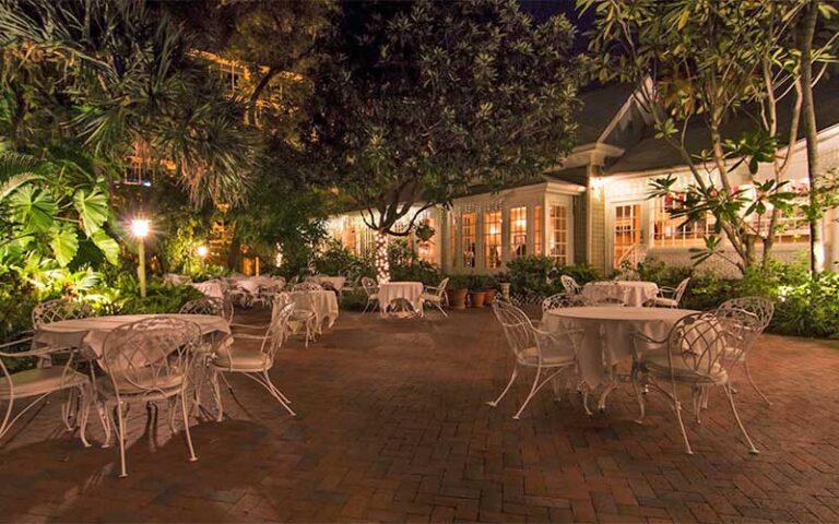 lovely patio area with garden at night with lighting at the veranda fort myers