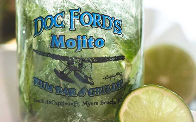 mojito drink served in jar style glass with logo and lime at doc fords rum bar and grille fort myers beach