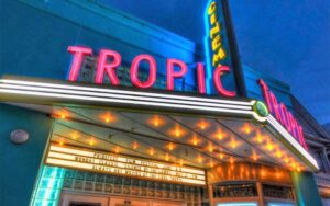 night exterior marquee sign above doors at tropic cinema key west